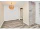 Bright living room featuring hardwood floors and modern lighting at 1300 Queens Rd # 409, Charlotte, NC 28207
