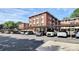 Street-level parking with covered parking spots under a brick apartment building at 1300 Queens Rd # 409, Charlotte, NC 28207