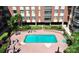 Aerial view of the apartment building's clean pool and surrounding patio at 1300 Queens Rd # 409, Charlotte, NC 28207