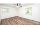 Bedroom featuring hardwood floors and natural light from the two windows at 1309 Poplar Cir, Newton, NC 28658