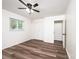Bedroom featuring hardwood floors, a ceiling fan and double door closet at 1309 Poplar Cir, Newton, NC 28658