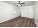Bedroom featuring hardwood floors, a ceiling fan and double closets for ample storage at 1309 Poplar Cir, Newton, NC 28658