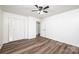 Bedroom featuring hardwood floors, a ceiling fan and large double door closet at 1309 Poplar Cir, Newton, NC 28658