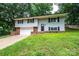 Charming two-story home with a landscaped yard and attached garage at 1309 Poplar Cir, Newton, NC 28658