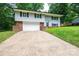 Charming two-story home with a landscaped yard and attached garage at 1309 Poplar Cir, Newton, NC 28658