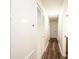 Hallway with wood floors and bright neutral paint provide a clean, modern aesthetic at 1309 Poplar Cir, Newton, NC 28658