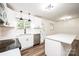 A bright kitchen featuring white cabinets, a stylish faucet, and stainless steel appliances at 1309 Poplar Cir, Newton, NC 28658
