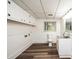 A finished laundry area in the basement featuring luxury vinyl plank flooring at 1309 Poplar Cir, Newton, NC 28658