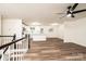 Open-concept space featuring modern flooring, white walls, stylish lighting, and kitchen access at 1309 Poplar Cir, Newton, NC 28658