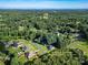 Aerial view of the property showcasing the home's location amidst lush greenery and surrounding neighborhood at 1622 Brookstone Dr, Hickory, NC 28602