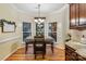 Bright breakfast nook with bay windows and wood flooring at 1622 Brookstone Dr, Hickory, NC 28602