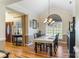 Stylish dining area with a large window, chandelier, and elegant furniture, perfect for entertaining at 1622 Brookstone Dr, Hickory, NC 28602