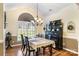 Elegant dining room with a chandelier, large window, and sophisticated decor at 1622 Brookstone Dr, Hickory, NC 28602