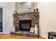 Close-up of a stone fireplace with decorative accents, creating a warm and inviting focal point at 1622 Brookstone Dr, Hickory, NC 28602