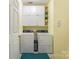 Functional laundry room with washer, dryer, and ample storage cabinets at 1622 Brookstone Dr, Hickory, NC 28602