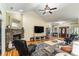 Open living space with hardwood floors, a stone fireplace, and vaulted ceilings, offering a cozy atmosphere at 1622 Brookstone Dr, Hickory, NC 28602