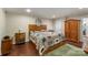 Spacious main bedroom featuring wood laminate floors, bedside tables, and natural light at 1622 Brookstone Dr, Hickory, NC 28602