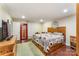Spacious main bedroom featuring wood laminate floors, tv, and natural light at 1622 Brookstone Dr, Hickory, NC 28602