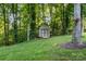 Charming shed nestled in a lush backyard setting, offering additional storage space at 1622 Brookstone Dr, Hickory, NC 28602