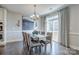 Inviting dining area featuring a modern chandelier, decorative wall art, and seamless indoor-outdoor transition at 1630 Riddle Ext, Clover, SC 29710