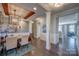 Elegant dining room with dark wood floors, decorative chandelier, and views into the kitchen at 1630 Riddle Ext, Clover, SC 29710