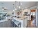 Bright, open kitchen featuring a large island, pendant lighting, modern appliances and an eat in space at 1630 Riddle Ext, Clover, SC 29710