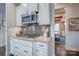 Modern kitchen detail featuring gas range, stylish tile backsplash, and seamless cabinetry at 1630 Riddle Ext, Clover, SC 29710