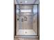 This modern shower features tile surround, shower niche, glass door, and transom window for natural light at 1630 Riddle Ext, Clover, SC 29710
