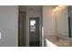 Bathroom featuring modern vanity, framed mirror, and a glass-enclosed shower at 1821 Augustine St, Monroe, NC 28112