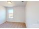 Bedroom featuring neutral carpet, a large window, and a bright, airy feel at 1821 Augustine St, Monroe, NC 28112