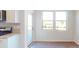 Cozy breakfast nook features hardwood floors, a large window and sliding door access at 1821 Augustine St, Monroe, NC 28112