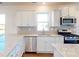 Modern kitchen with granite countertops, stainless steel appliances, and white cabinetry at 1821 Augustine St, Monroe, NC 28112