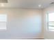 Bright living room featuring hardwood floors and large windows providing natural light at 1821 Augustine St, Monroe, NC 28112