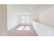 Spacious loft area with neutral carpet and ample natural light from the windows at 1821 Augustine St, Monroe, NC 28112