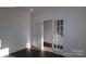Bright office space featuring elegant french doors and dark hardwood floors at 1821 Augustine St, Monroe, NC 28112