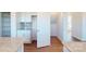 Walk-in pantry featuring ample shelving, granite counters, and hardwood floors at 1821 Augustine St, Monroe, NC 28112