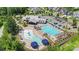 Aerial view of neighborhood amenities including a pool, splashpad, playground and clubhouse with parking at 2052 Masons Bend Dr, Fort Mill, SC 29708