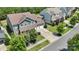 Aerial view of a house with a large yard and three-car garage, surrounded by lush greenery and neighborhood streets at 2052 Masons Bend Dr, Fort Mill, SC 29708
