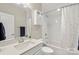 Well-lit bathroom with white cabinets, a quartz countertop, a large mirror, and a shower-tub combination at 2052 Masons Bend Dr, Fort Mill, SC 29708