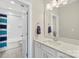 Fresh bathroom featuring white cabinets, a single sink, quartz countertops, a large mirror, and a tub-shower combo at 2052 Masons Bend Dr, Fort Mill, SC 29708