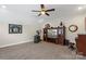 Spacious bonus room with a ceiling fan, entertainment center, exercise equipment, and comfortable furnishings at 2052 Masons Bend Dr, Fort Mill, SC 29708