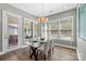 Bright dining area featuring a modern chandelier, table with seating, and plenty of natural light at 2052 Masons Bend Dr, Fort Mill, SC 29708