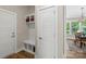 View of the entryway featuring mudroom-style built-ins with bench and storage, leading into the dining room at 2052 Masons Bend Dr, Fort Mill, SC 29708