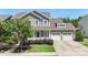 Inviting two-story home with a two-car garage, a welcoming front porch, and beautifully maintained landscaping at 2052 Masons Bend Dr, Fort Mill, SC 29708