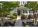 Charming home entrance featuring a well-manicured walkway and beautiful landscaping around the front porch at 2052 Masons Bend Dr, Fort Mill, SC 29708