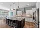 Modern kitchen featuring an island with barstool seating, pendant lights, and stainless steel appliances at 2052 Masons Bend Dr, Fort Mill, SC 29708
