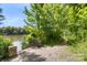 Scenic lake view with lush greenery and a tranquil walking path; perfect for enjoying nature at 2052 Masons Bend Dr, Fort Mill, SC 29708