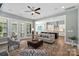 Bright living room featuring an open floor plan, ceiling fan and an eat-in kitchen with modern stainless appliances at 2052 Masons Bend Dr, Fort Mill, SC 29708
