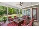 Cozy screened-in patio with comfortable seating and view of the lush green backyard at 2052 Masons Bend Dr, Fort Mill, SC 29708
