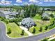 A high angle view showcasing a modern white home with a well-manicured lawn and a neatly paved driveway at 2148 Nims Village Dr, Fort Mill, SC 29715